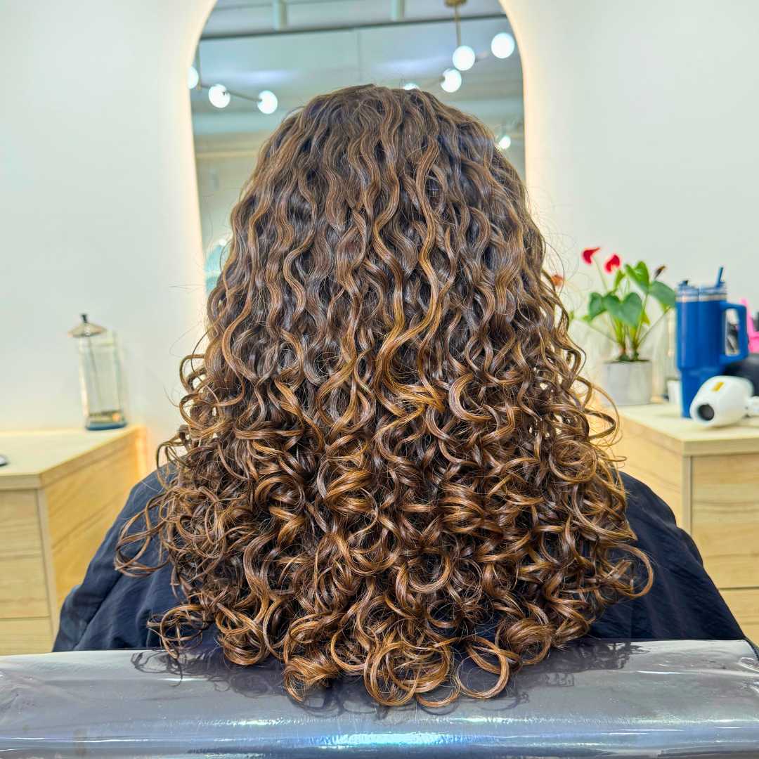 Transformed wavy hair into soft curly shape with enhanced curl definition