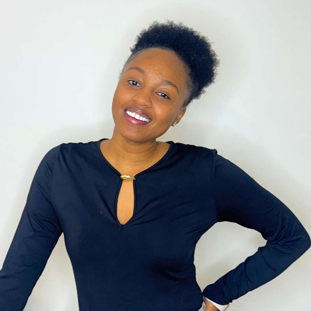 Curly hair stylist Maya working on curls at Destini Curl Spa Vancouver